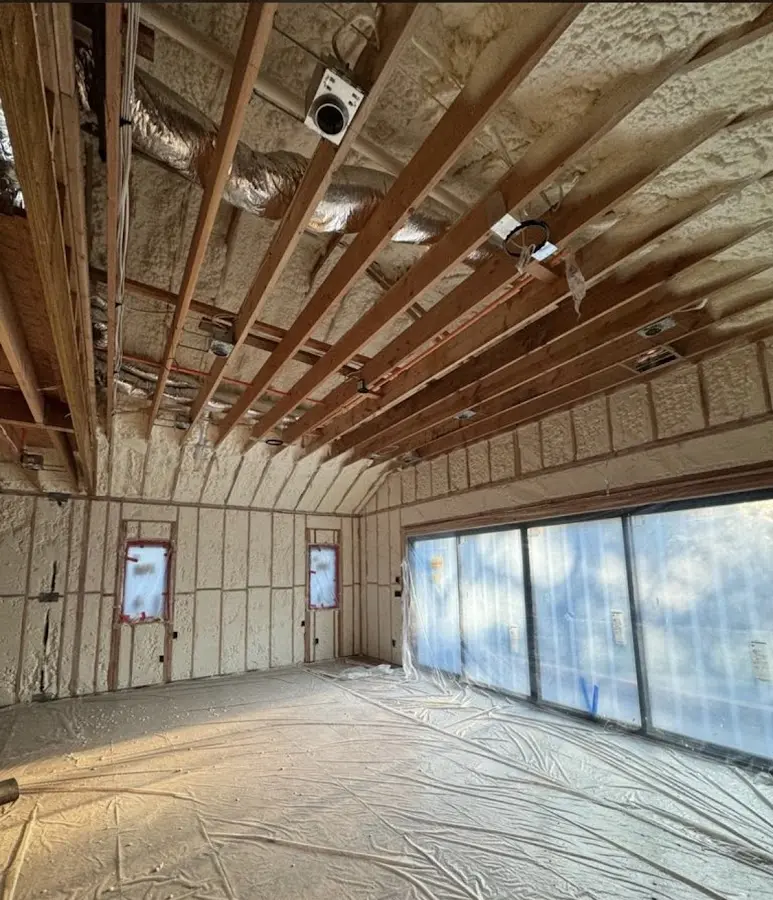Interior walls and ceiling insulated with spray foam during new construction in Lenox